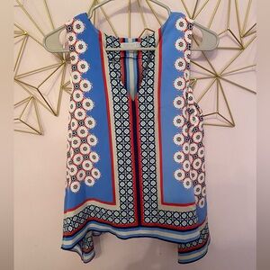 1. State Small sleeveless blouse. Flowy material.